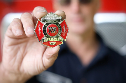 Woodinville Fire and Rescue Badge being held
