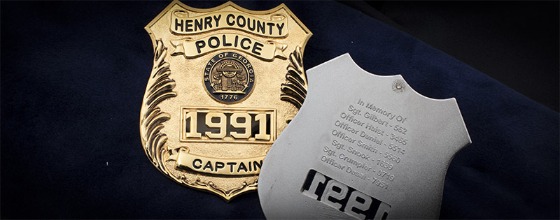 Henry County Police Badge front and back with list of names of their fallen officers