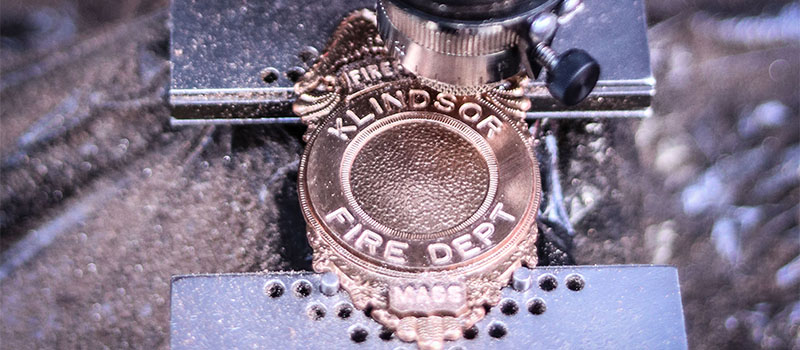 Engraved Lettering on a police or fire custom badge