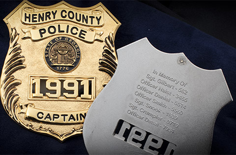 Henry County Police Badge front and back with list of names of their fallen officers