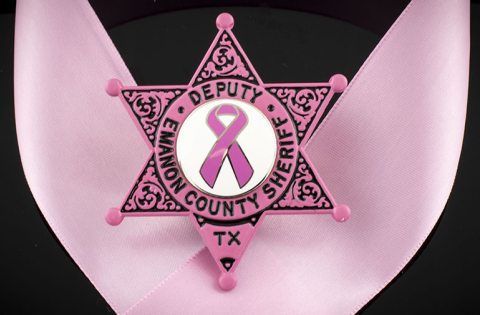 Pink six point star badge for breast cancer awareness