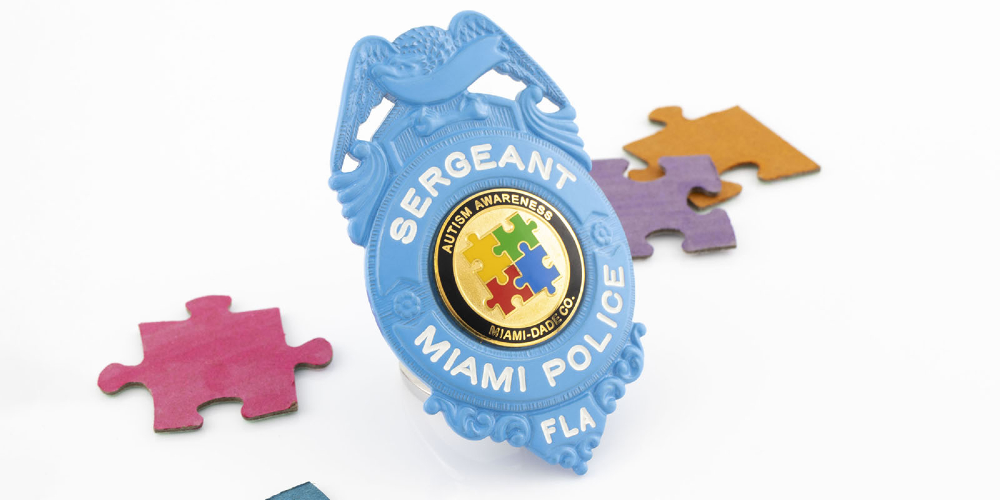 Blue autism badge for miami police