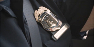 Badge worn with seatbelt next to the badge
